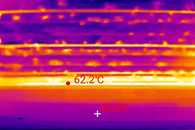 Thermal image of an uninsulated metal roof deck, 62.2 degrees at the hottest band